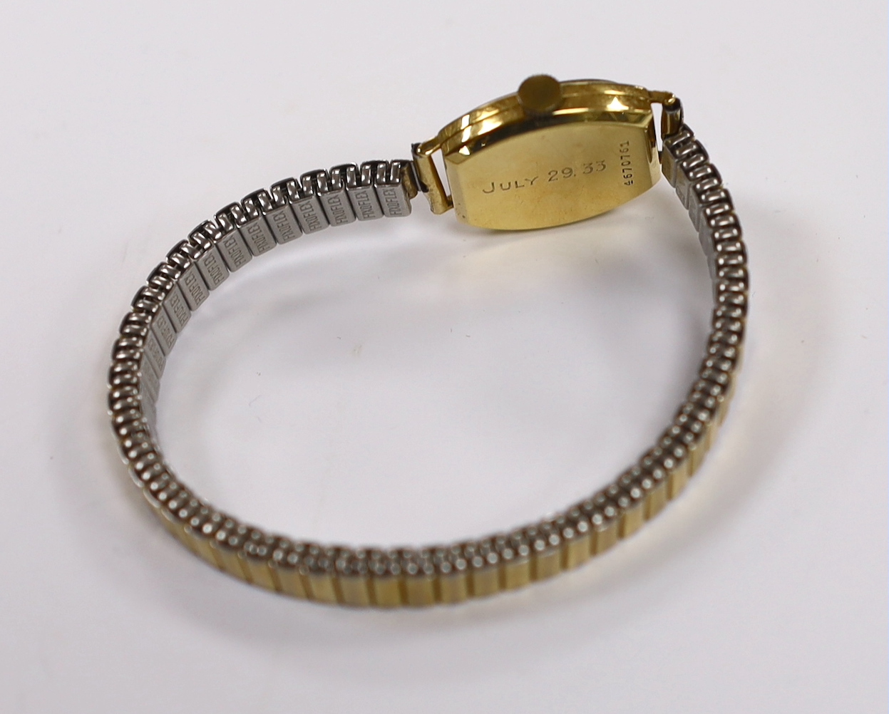 A lady's 1930's 18ct gold Longines manual wind wrist watch, with case back inscription, on a later associated steel and gold plated flexible strap.